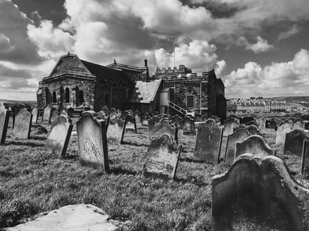 The cemetery at Whitby Abbey overlooking the sea. Photo mine.